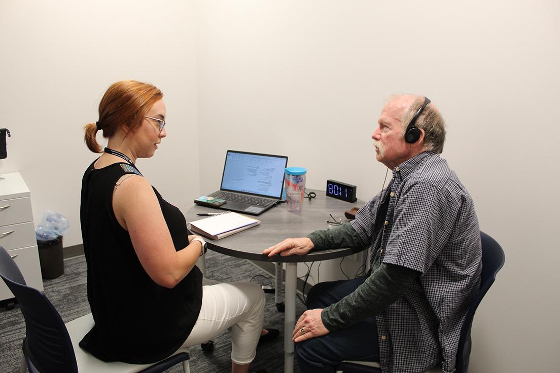 Graduate MS SLP student (right) working with an older adult (left)